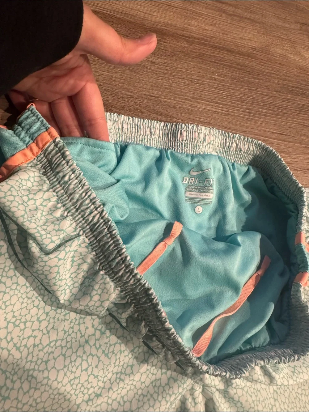 Nike Women's Light Teal Athletic Shorts with Coral Trim